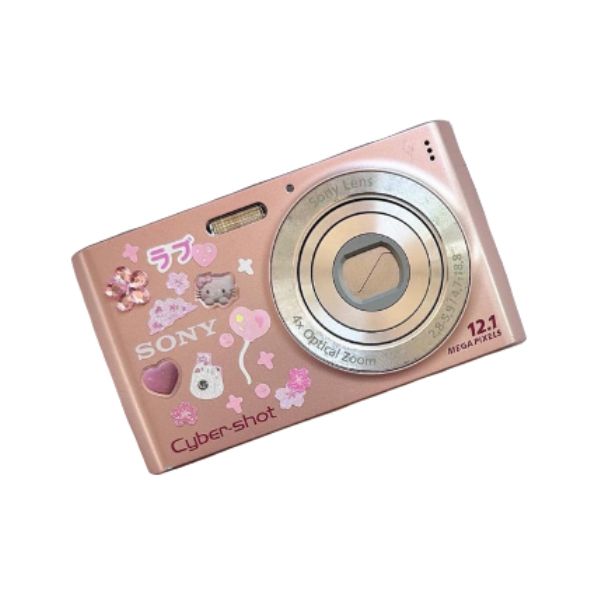 a pink digital camera sitting on top of a white surface