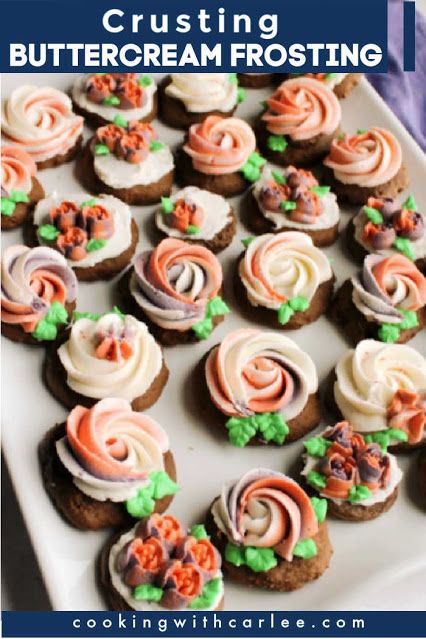 a white plate topped with cupcakes covered in frosting