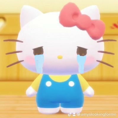 the hello kitty character is wearing overalls and a bow