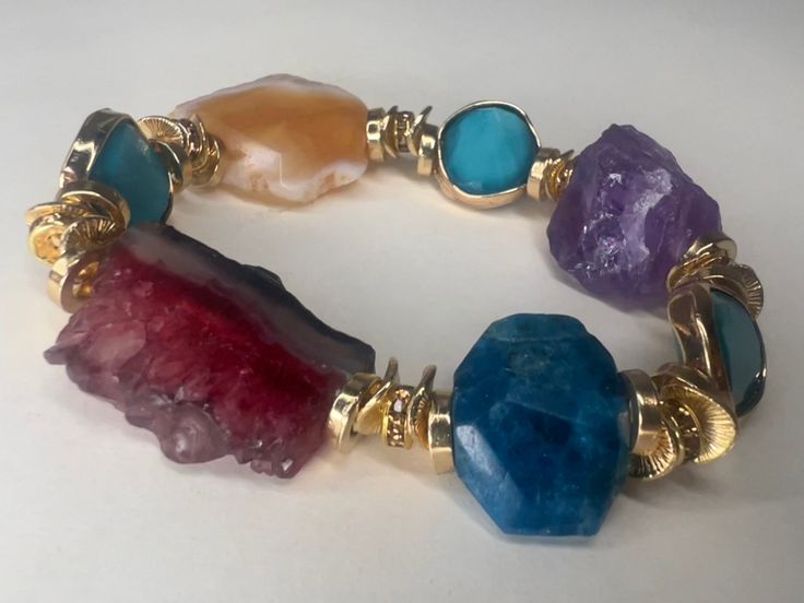 We'd love to introduce you to this Beautifully curated design of 4 Semi Precious Stone Mix bracelets. When we handcrafted this design, it became more than just a regular release of accessories. This design consists of years of collecting and finally piecing together. Ranging from an array of Amethyst, Agate and Amazonite, these precious stones are rare and are meant for only ONE person. If you resonate with these pieces, this is definitely for you. * Handmade Item * One of a Kind * Consists of 4 Fusion Style Bracelet With Unique Variations As A Gift, One Of A Kind Multicolor Jewelry Bracelet, One Of A Kind Multicolor Bracelet, Modern Gemstone Accents Bracelets As Gift, Modern Bracelets With Gemstone Accents For Gift, Luxury Multicolor Stone Bracelets, Luxury Multicolor Bracelets With Stones, Unique Multi-stone Bangle Bracelet, Unique Multi-stone Bangle Bracelets