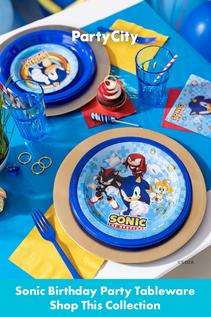 the sonic birthday party tableware is set up with blue and gold plates, napkins, and decorations