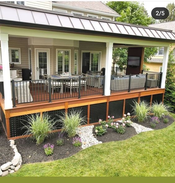 a small house with a deck and patio