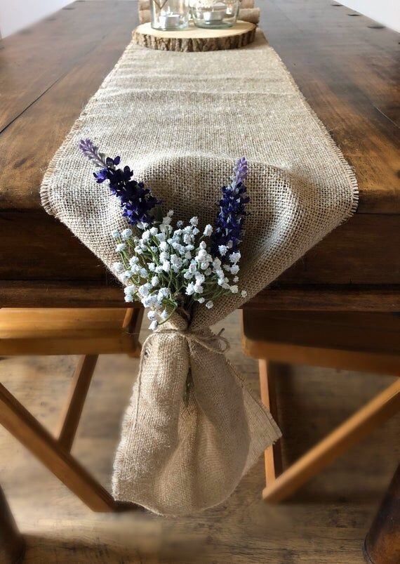 a burlock table runner with lavenders tied to it