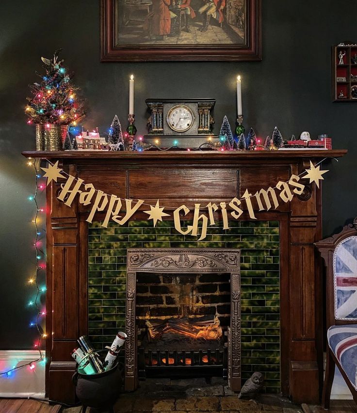 a fireplace decorated for christmas with lights and decorations on it, along with a flag that reads happy christmas