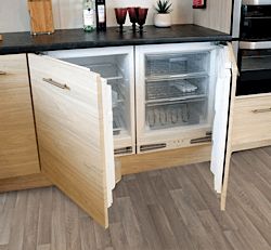 an open refrigerator in the middle of a kitchen