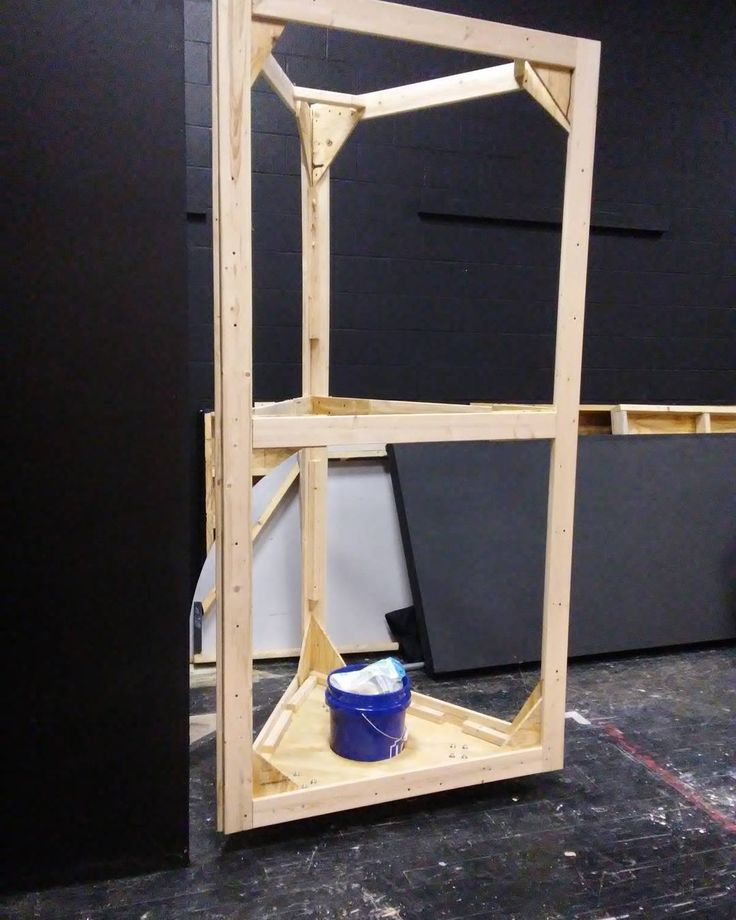 an unfinished shelving unit is shown in the process of being built