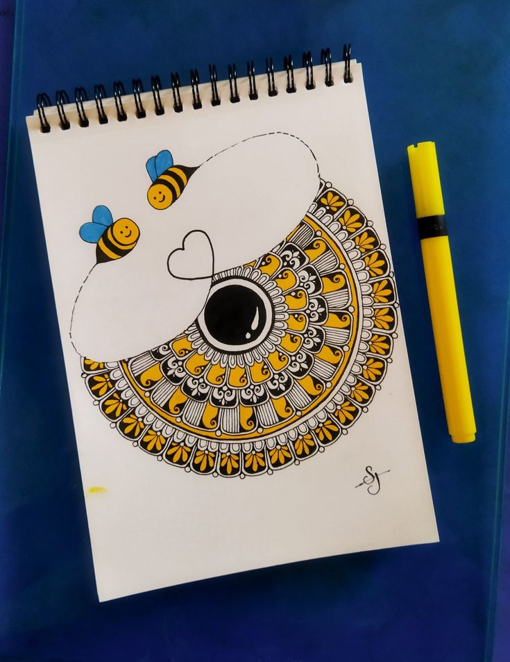 a drawing of a bear with bees on it and a yellow marker next to it