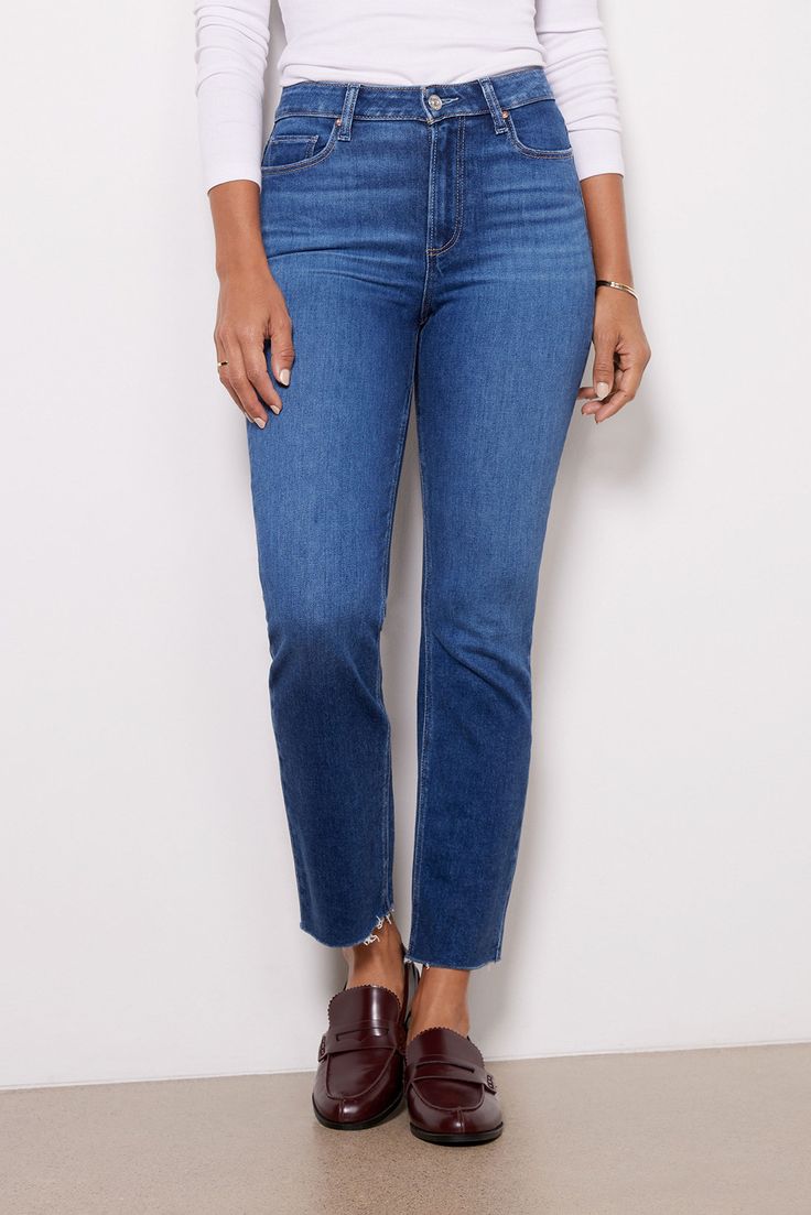 With a classic straight leg and versatile blue wash, you'll be wearing these Paige jeans on repeat. The Cindy is crafted in soft stretch denim and features a flattering high rise and raw cut hems. Straight Bottoms With Frayed Hem In Medium Wash, Dark Wash Straight Leg Jeans With Frayed Hem, Medium Wash Straight Bottoms With Frayed Hem, Straight Bottoms With Medium Wash And Frayed Hem, Straight Fit Bottoms With Frayed Hem In Medium Wash, Fall Straight Leg Cropped Jeans With Frayed Hem, Straight Leg Cropped Jeans With Frayed Hem For Fall, Fall Cropped Straight Leg Jeans With Frayed Hem, Medium Wash Straight Cropped Mom Jeans