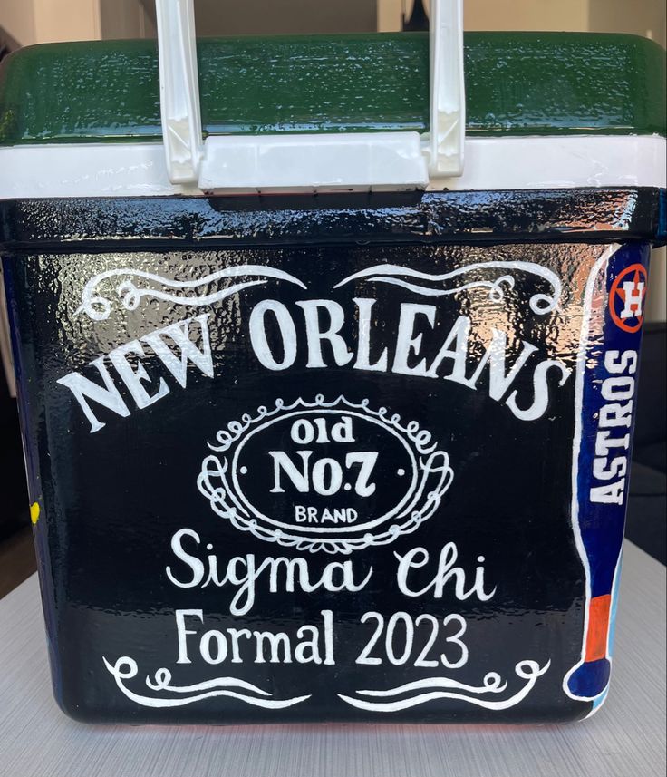 a new orleans sign painted on the side of a cooler