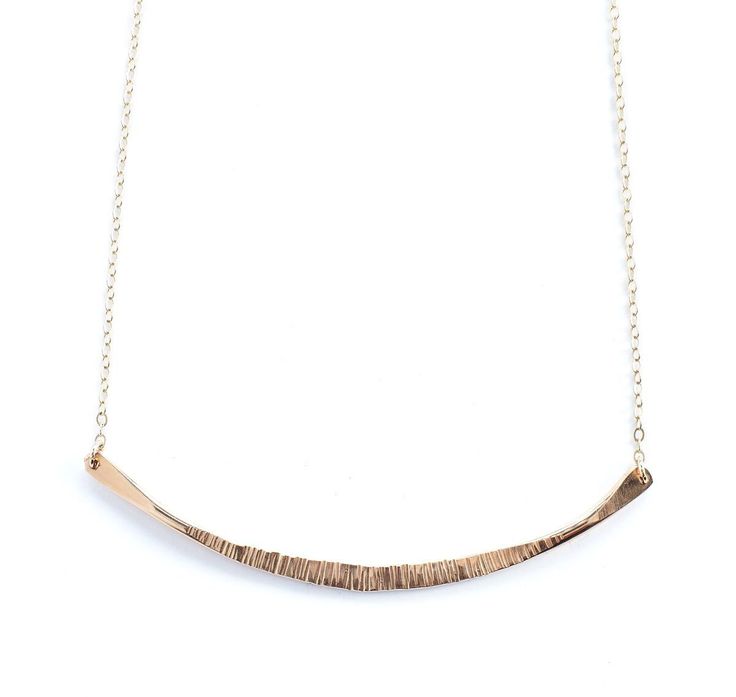 From Fail Jewelry: With an understated elegance, the Galena necklace embodies a distinctive, minimal presence for a welcomed addition to any collection. Comprised of a sleek, textured bar, this delicate hammered necklace easily elevates any look. Whether worn alone or layered with your favorites, this versatile necklace will be a go-to for years to come. Available in 14K yellow gold fill. Measures 18" long. THE DESIGNER With a BFA in studio art, designer Christine Fail's background is firmly roo Modern Hammered Yellow Gold Necklace, Minimalist Gold Hand Forged Necklace, Delicate Hammered Yellow Gold Necklace, Dainty Hammered 14k Gold Necklace, Dainty Hammered Rose Gold Necklace, Dainty Hand Forged Necklace For Everyday, Everyday Minimalist Hand Forged Necklaces, Minimalist Everyday Hand Forged Necklaces, Minimalist Hammered Yellow Gold Necklace