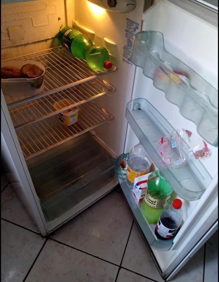 an open refrigerator filled with drinks and food