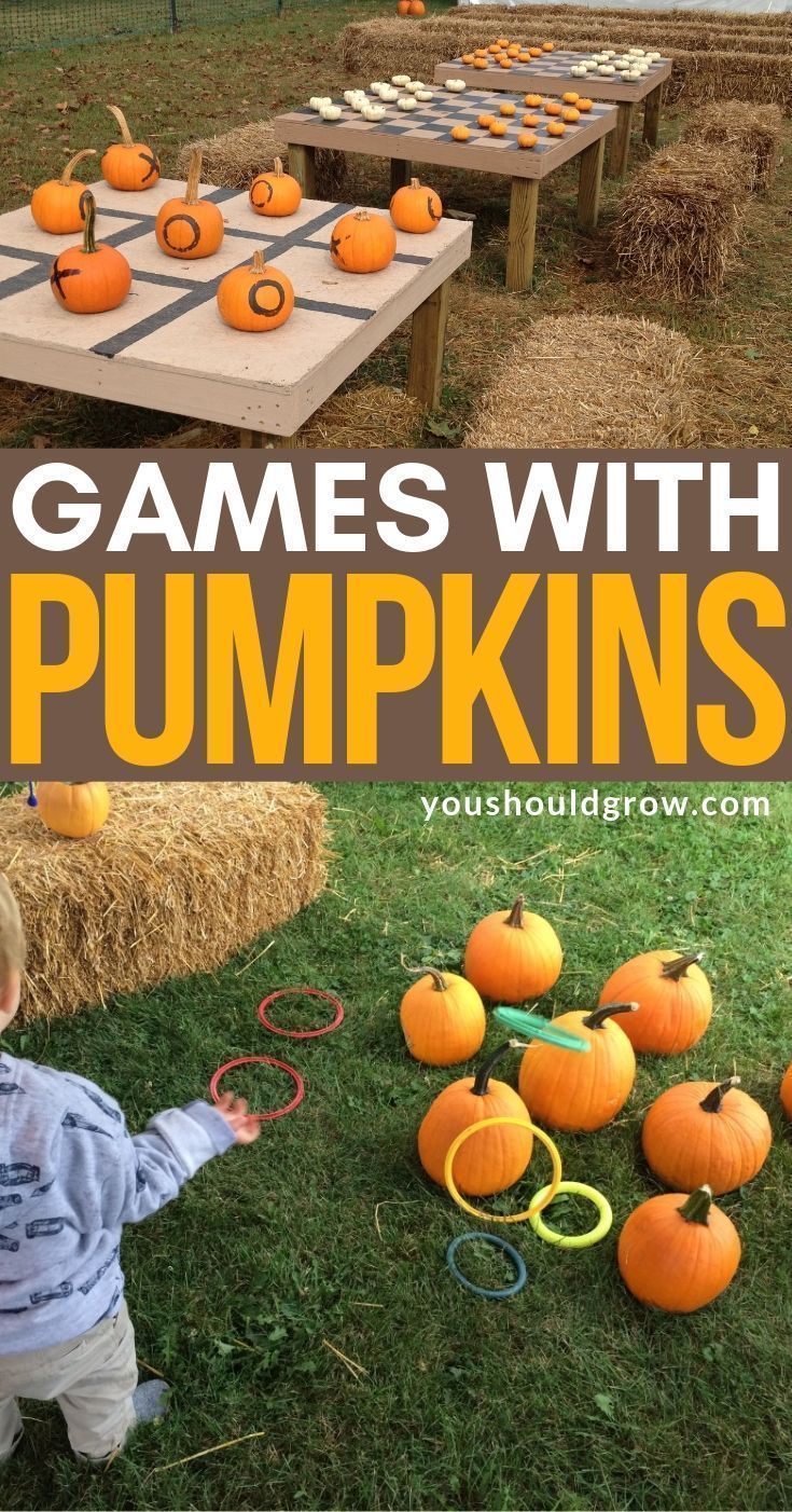 a young boy playing with pumpkins in the yard