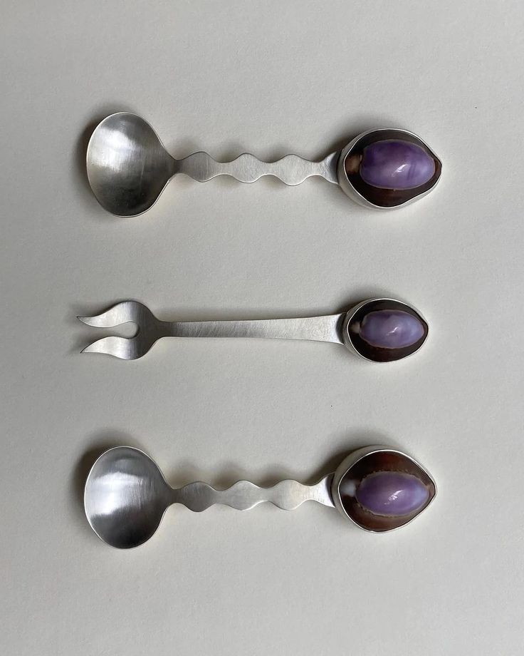 three spoons with different shapes and colors on them