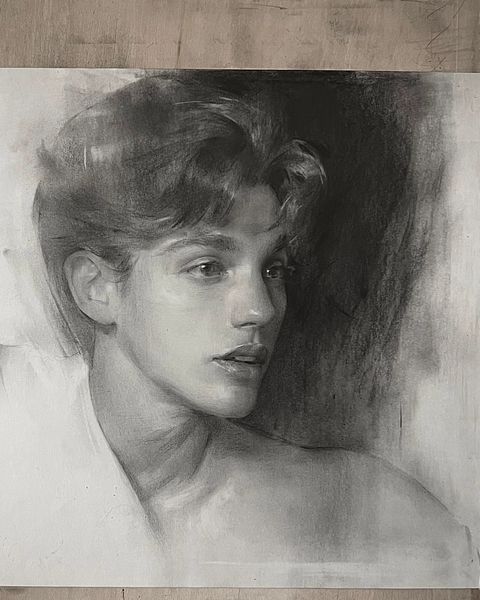 a black and white drawing of a young man