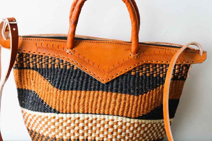 African sisal bag is handmade out of sisal fibre which is durable and has leather straps.

It has an inner lining

Processing time: 1-3 days

Dimensions:
Height: 9 inches
width: 10 inches
Strap height: 29 inches

Shipping via DHL Express which takes 3-5 days to be delivered.

Has great uses as it can be used as a shopping bag, weekend bag or while on the beach. Leather Basket Shoulder Bag With Adjustable Strap, Brown Leather Basket-shaped Bag, Leather Basket Bag With Adjustable Strap, Brown Leather Straw Bag With Adjustable Strap, Brown Leather Bag With Adjustable Strap, Woven Leather Bags In Natural Color, Woven Leather Satchel In Natural Color, Handmade Leather Basket Straw Bag, Handmade Leather Straw Basket Bag