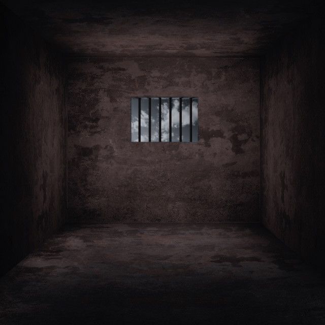 an empty room with bars on the wall and one window in the middle that is open