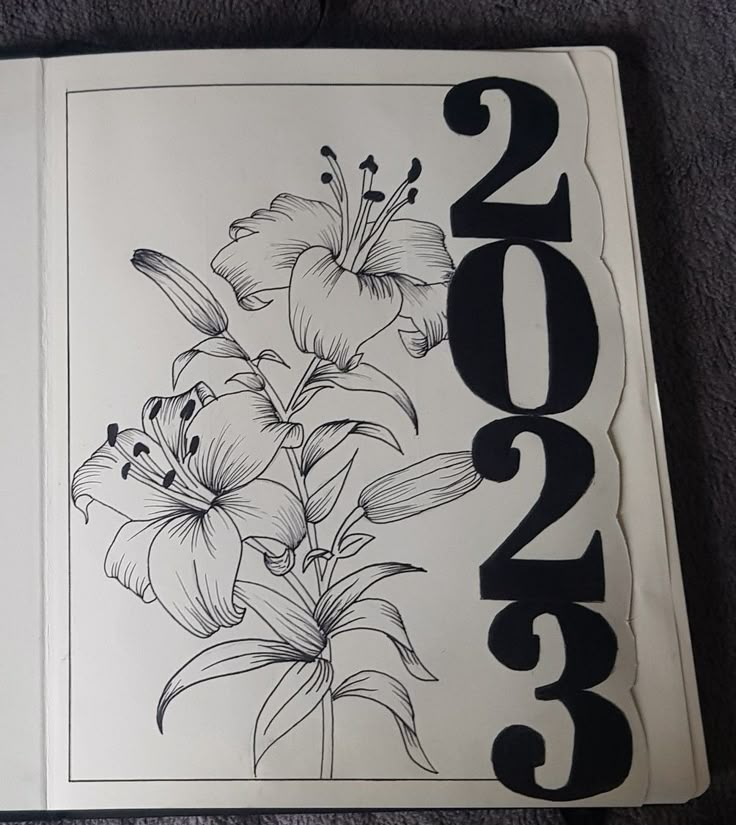 a white book with black numbers and flowers on the front cover that reads 2013,