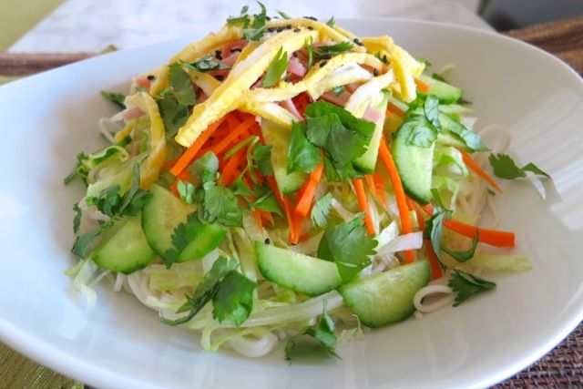 a white plate topped with salad and veggies