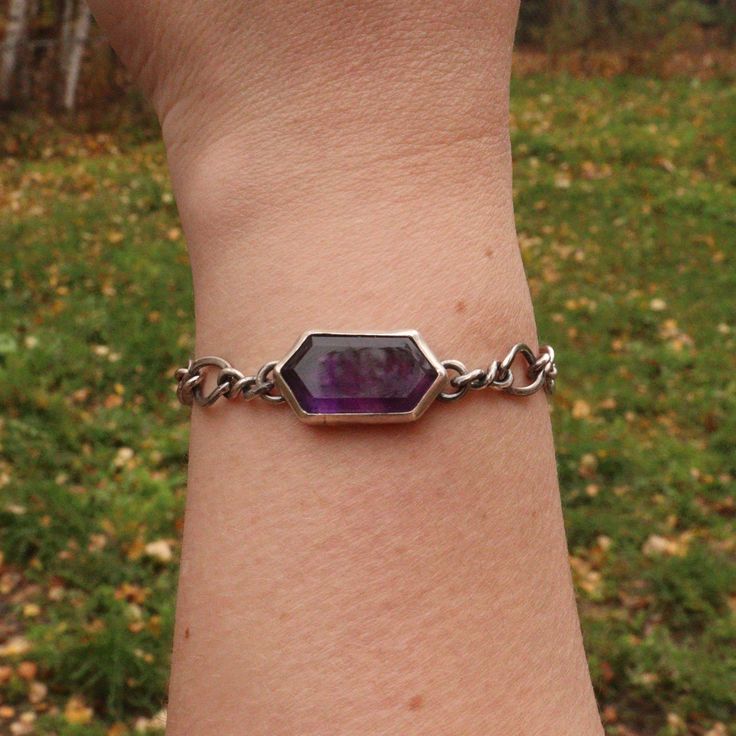 A rich purple amethyst makes this simple everyday chain transform into an iconic style accessory. Stone meanings: Amethyst is associated with the Third Eye and Crown chakras, which are said to promote spiritual growth, intuition, and higher consciousness. Amethyst is said to promote clarity and insight, and to calm the mind. Details: This unique bracelet features up cycled silver chain and a beautifully cut amethyst stone. All Bracelets are able to be made shorter. If you need additional chain o Everyday Purple Amethyst Bracelet, Spiritual Sterling Silver Chain Bracelet, Purple Spiritual Jewelry For Everyday, Spiritual Purple Jewelry For Everyday, Everyday Spiritual Purple Jewelry, Stone Meanings, The Third Eye, Higher Consciousness, Rich Purple