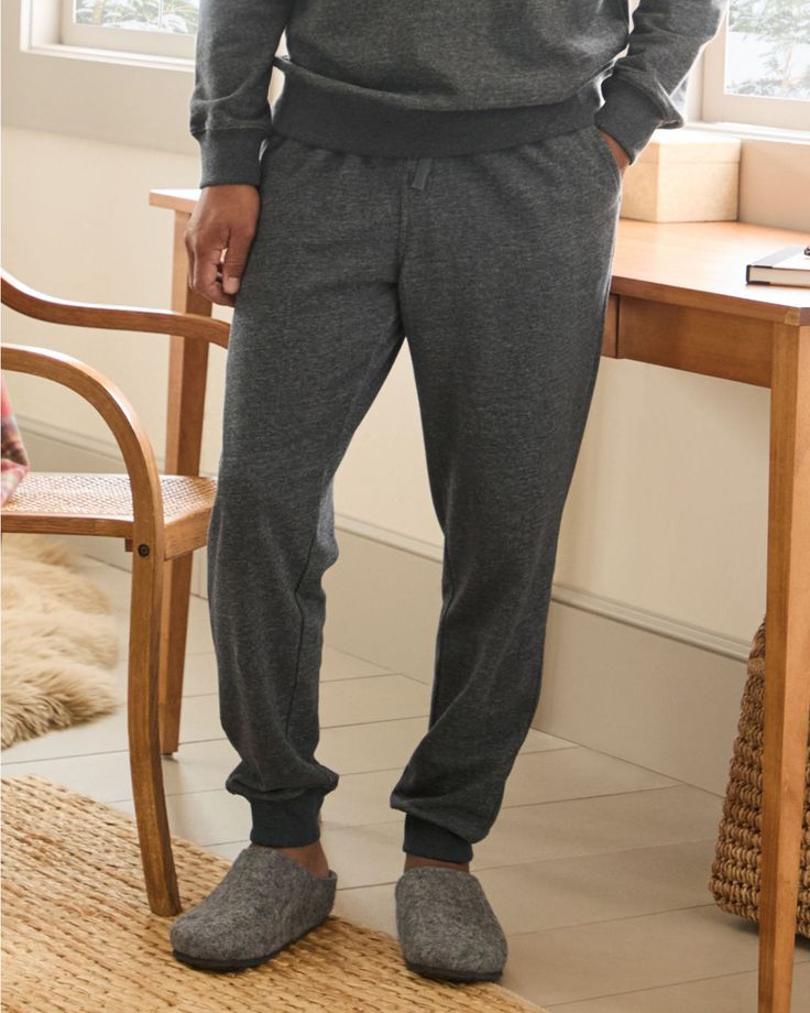 Easygoing style, for lounging or playing. Our version of his favorite sweatpants is super-comfy in brushed-back French terry. Coordinates with our Men's Button-Front Sweatshirt or Men's Crewneck Sweatshirt.  Exclusive. Elasticized waist with drawcord and faux fly. Angled pockets. Single back patch pocket. Rib-knit detail at the waist and cuffs. Fleece Joggers For Lounging, Gray Sweats With Ribbed Cuffs For Lounging, Comfortable Gray Sweats For Loungewear, Comfortable Fleece Joggers For Lounging, Fleece Sweatpants With Ribbed Cuffs For Lounging, Relaxed Fit Fleece Sweats For Loungewear, Cozy Fleece Sweatpants For Loungewear, Comfy Fleece Joggers For Loungewear, Gray Sweatpants With Ribbed Cuffs For Loungewear