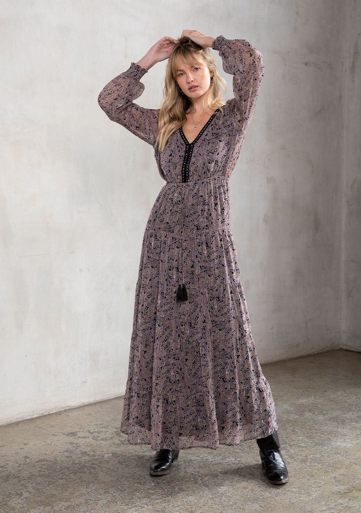 [Color: Black/Orchid] A model wearing a sheer black and orchid paisley print bohemian maxi dress. With contrast crochet trim Ethereal Style, Delicate Crochet, Clothing Sketches, Sheer Maxi Dress, Boho Paisley, Paisley Maxi Dress, Voluminous Sleeves, Bohemian Maxi, Bohemian Maxi Dress