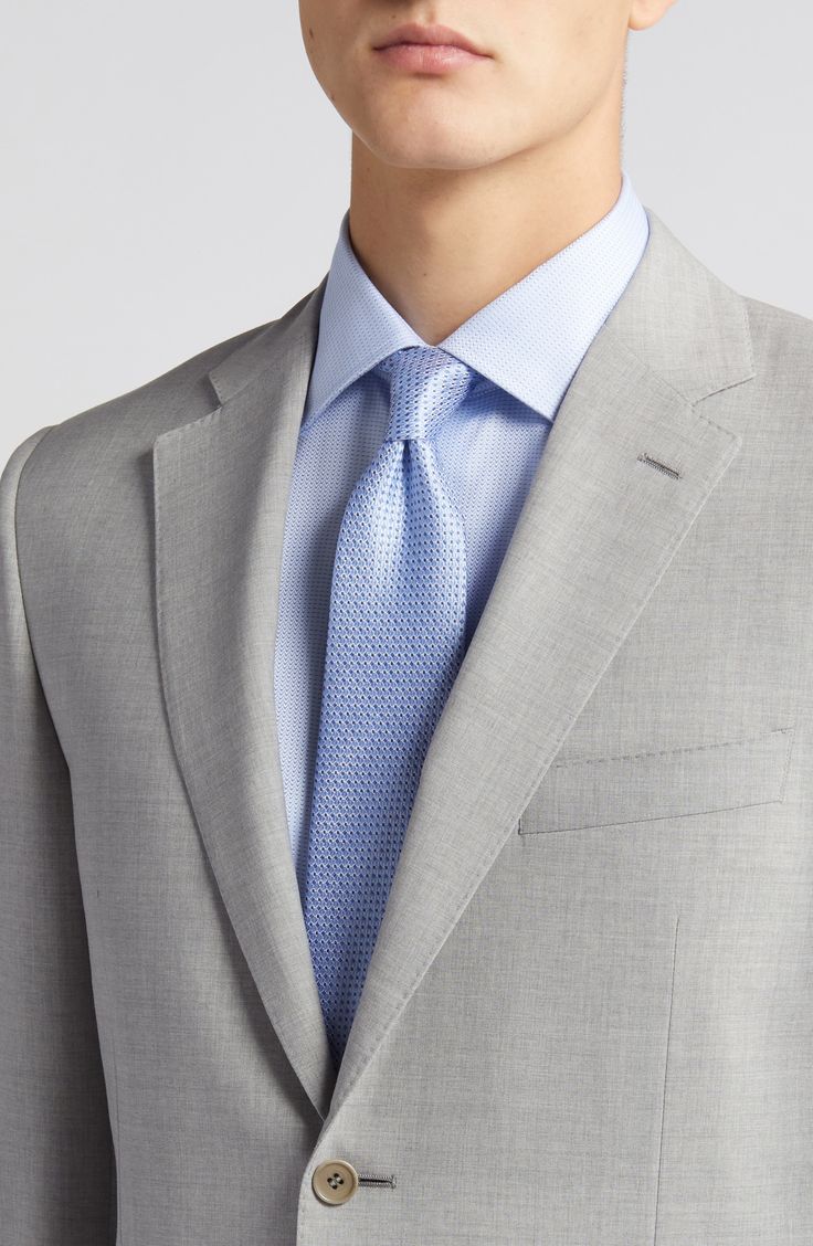 Italian wool woven in a subtly heathered grey brings polish and distinction to a suit styled with traditional detailing for all-occasion versatility. Jacket has notched lapels; four-button cuffs; chest pocket; flap pockets; side vents Cuff buttons may not be attached. Jackets purchased at full price can have the sleeve length customized for free at your local Nordstrom Trousers have zip fly with button-tab closure; slant pockets; back button-welt pockets Jacket is lined Unhemmed 100% wool Dry cl Classic Gray Suits For Work, Classic Gray Suits With Welt Pockets, Tailored Gray Suit And Tie Accessories For Formal Occasions, Tailored Gray Suit For Formal Occasions, Gray Formal Suit With Suit Collar, Formal Gray Suit With Suit Collar, Classic Gray Business Casual Suit, Formal Gray Wool Blazer, Timeless Gray Suits For Workwear