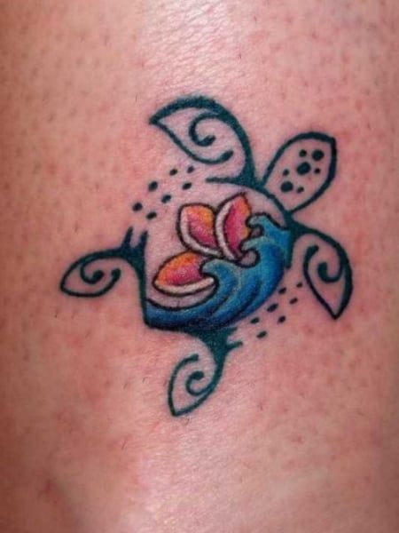 a small tattoo on the side of a woman's leg, with an image of a