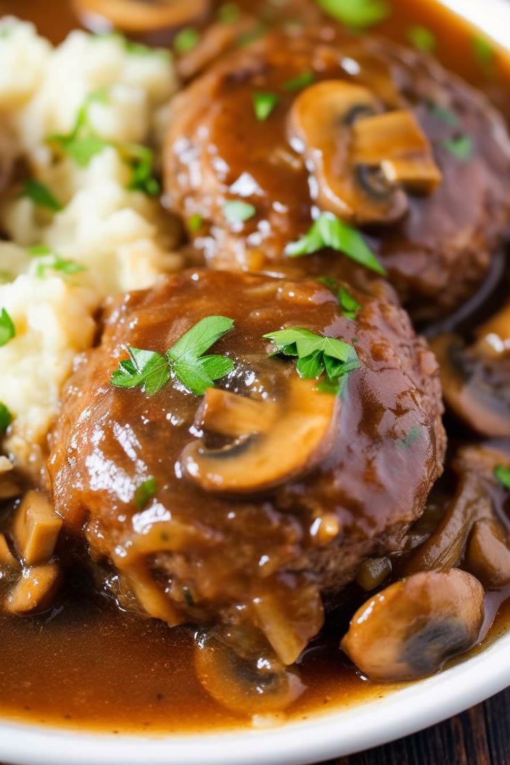 meat and mushrooms in gravy with mashed potatoes