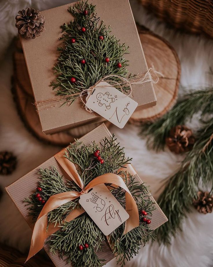 two wrapped presents with pine cones and red berries