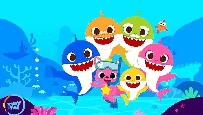 a group of cartoon sharks swimming in the ocean