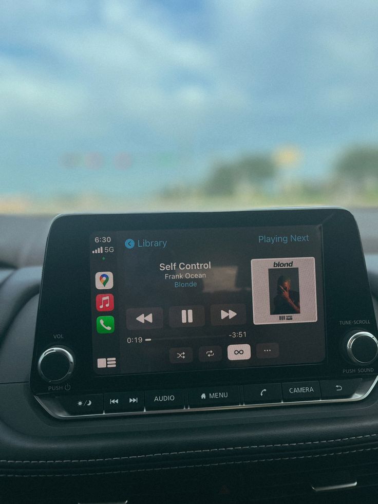 the dashboard of a car with an apple carp app on it's display screen