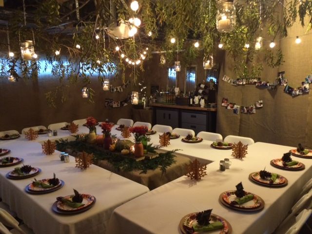 a long table with plates and place settings set up for a formal dinner in a restaurant