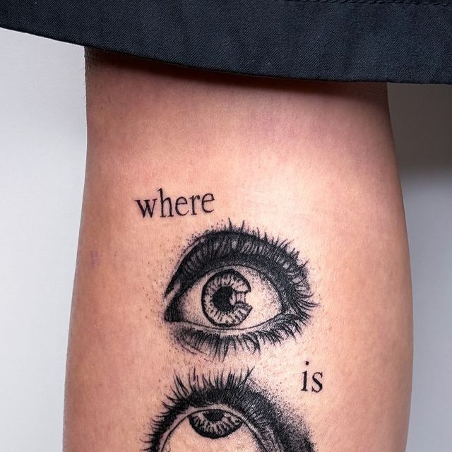 a woman's thigh with an eye tattoo that says, where is it?