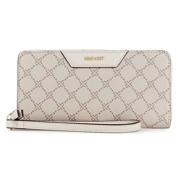 Keep all of your cards and essentials neatly organized in this stylish Nine West Astoria Zip Around Wristlet. Keep all of your cards and essentials neatly organized in this stylish Nine West Astoria Zip Around Wristlet. DETAILS 4" H x 8" W x 1.25" D Wallet converts to wristlet 1 interior zip pocket, 12 card slots, 2 slip pockets 1 exterior zip pocketCONSTRUCTION & CARE Polyurethane Cotton twill lining Wipe clean Imported Size: One Size. Color: Mushroom. Gender: female. Age Group: adult. Cute Wallet, Clutch Purse Black, Oversized Clutch, Floral Clutches, Cute Wallets, Wallet Wristlet, Wristlet Wallet, Leather Wristlet, Mini Boden