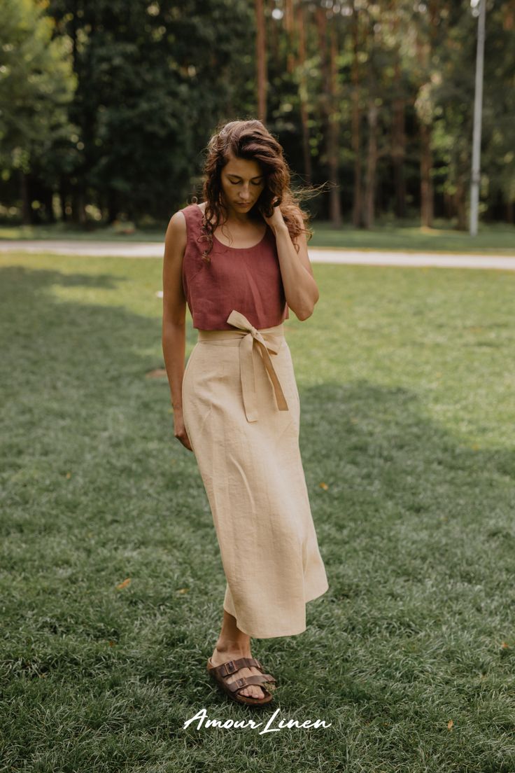 Wrap Linen Skirt: A boho style and minimal aesthetics. This skirt, adorned with a charming bow, is your ticket to effortless elegance. It's the go-to choice for fall looks for women, whether you're embracing casual chic or seeking the perfect party look. Perfect for work or a casual evening out outfit. IRIS is not just a trendy fall outfit; it's the ideal choice for fall weddings, date nights. Add this piece to your capsule wardrobe and enjoy free shipping on orders over $100! Summer Asymmetrical Wrap Skirt With Tie Waist, Elegant Summer Skirt With Tie Waist, Elegant Asymmetrical Wrap Skirt For Summer, Elegant Asymmetrical Summer Wrap Skirt, Summer Wrap Skirt For Brunch, Lined, Summer Brunch Wrap Skirt With Lined Detail, Summer Brunch Wrap Skirt With Lining, Elegant Linen Bottoms With Tie Waist, Chic Relaxed Beige Wrap Skirt