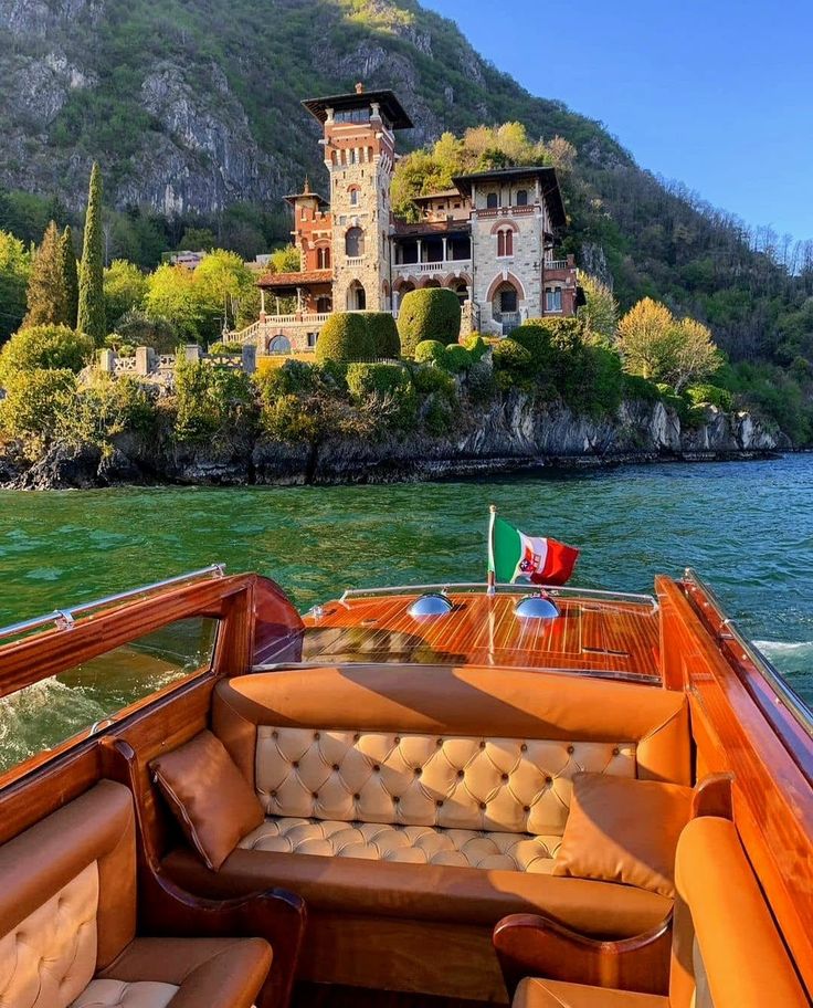 the inside of a boat with an old castle in the background