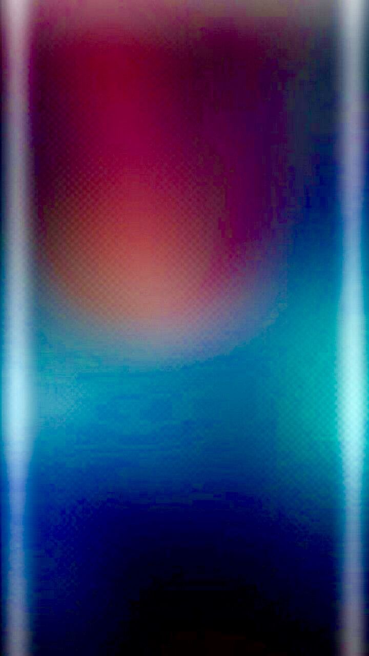 a blurry image of an orange and blue background