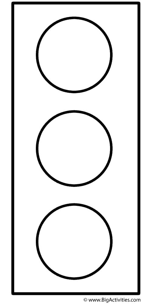 a traffic light that is black and white with circles on the bottom, in front of it