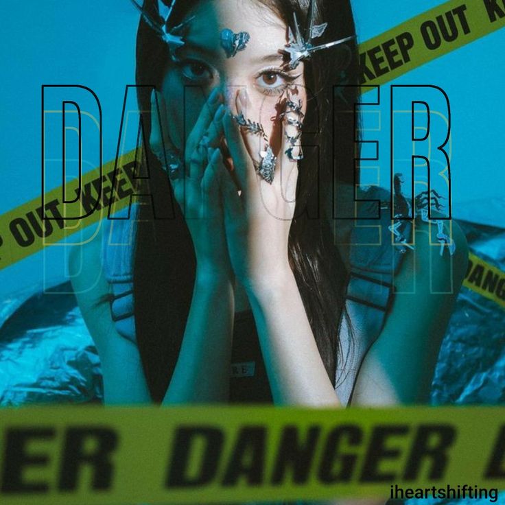 a woman with her hands on her face in front of caution tape and blue background