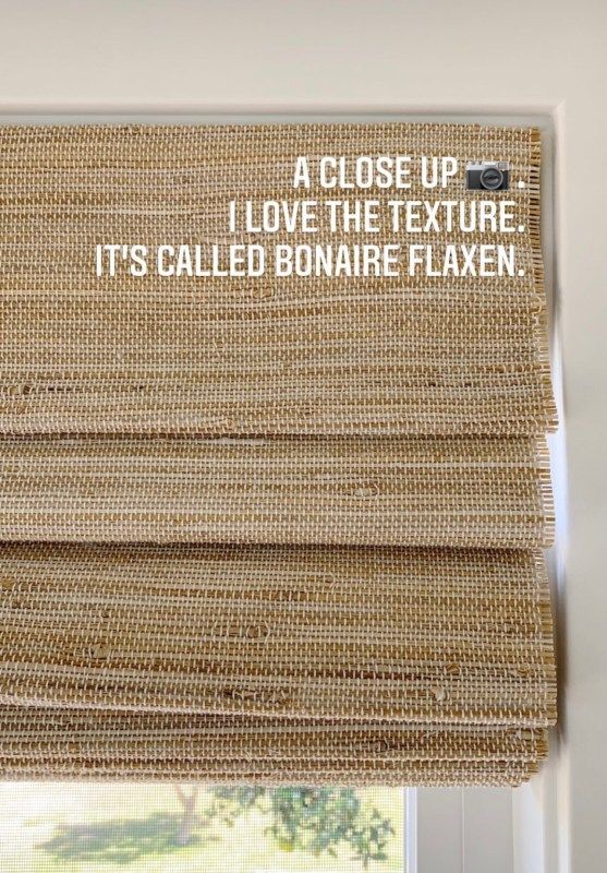 a close up of a window with a roman blind in front of it that says, i love the texture it's called bonaire flexen