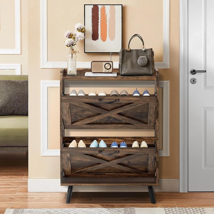 a wooden shoe rack sitting on top of a hard wood floor next to a door