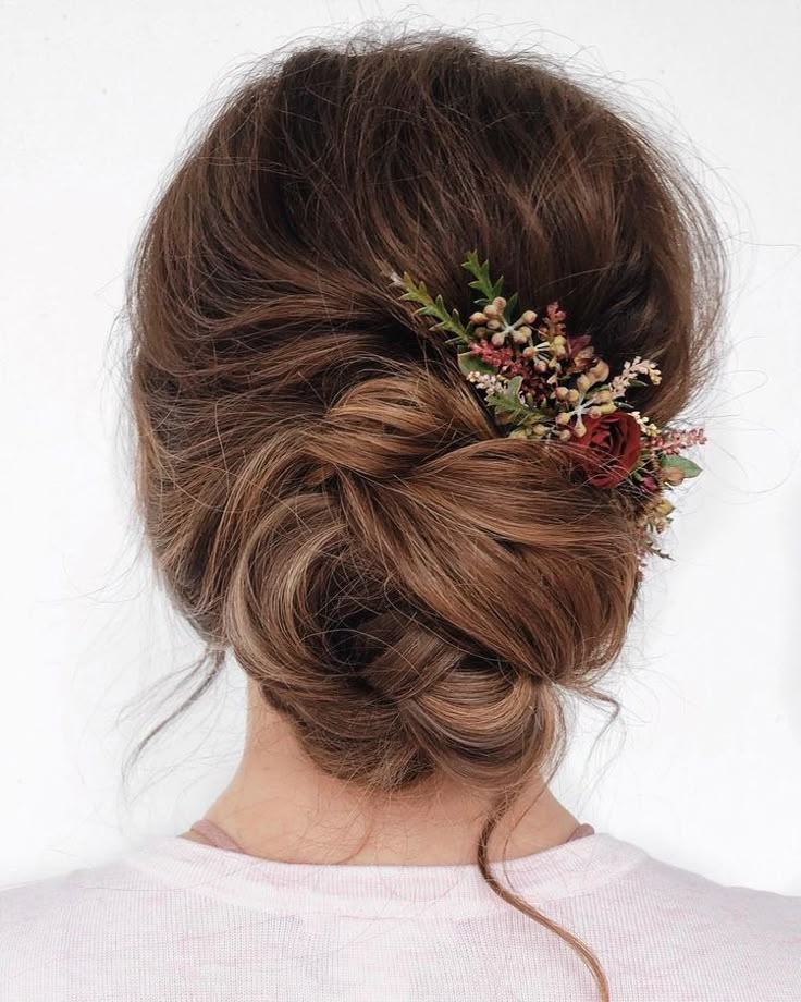 the back of a woman's head with flowers in her hair, and text that reads