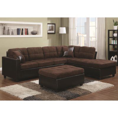 a living room scene with focus on the sectional sofa and footstool in the center