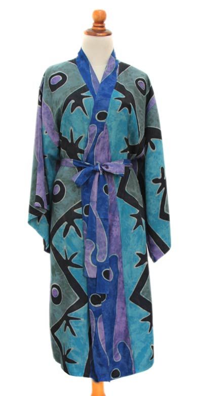 This exquisite rayon batik robe by Desak Nyoman Parwati envelops the wearer in a languid Balinese danau ( lake ) of swirling blue. As beautiful as it is comfortable its flattering front-wrap style wide sleeves and matching belt make this rayon robe a summer favorite.This handpainted batik robe is a truly original work of art. Sunlight water dye and temperature all factor into the look of the finished robe. This should be considered a unique design made especially for you. Colors and pattern plac Batik Art, Summer Favorites, Women Artisans, Balinese, Wide Sleeves, Blue Shorts, Original Work, Textile Design, Wrap Style