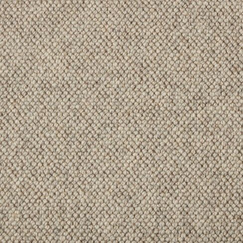 an up close shot of a beige carpet