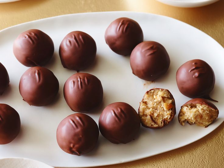 chocolates are arranged on a white plate and ready to be eaten