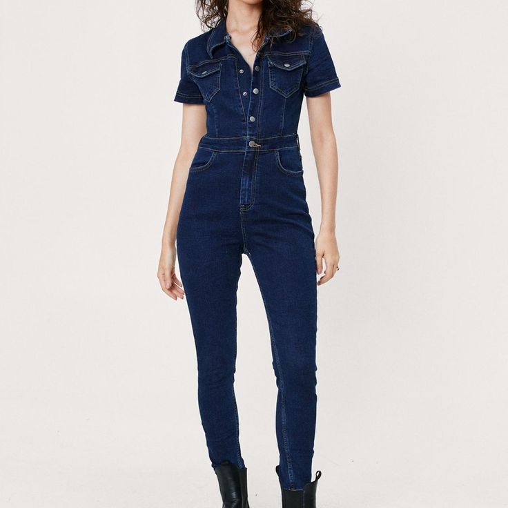 Nwt Nastygal Short Sleeve Fitted Denim Boilersuit In Mid Blue Fitted Denim Blue Jumpsuit With Pockets, Fitted Denim Overalls With Short Sleeves, High Waist Bodysuit For Work, Medium Wash Fitted Denim Jumpsuit With Short Sleeves, Fitted High Rise Denim Jumpsuit, Fitted Denim Jumpsuit With Pockets And Short Sleeves, Fitted High-waist Denim Blue Jumpsuit, Fitted High Waist Bodysuit For Work, Blue Stretch Denim Jumpsuit With Short Sleeves