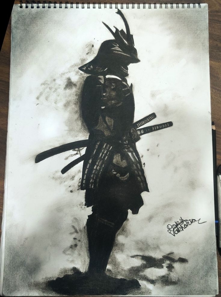 a black and white photo of a samurai