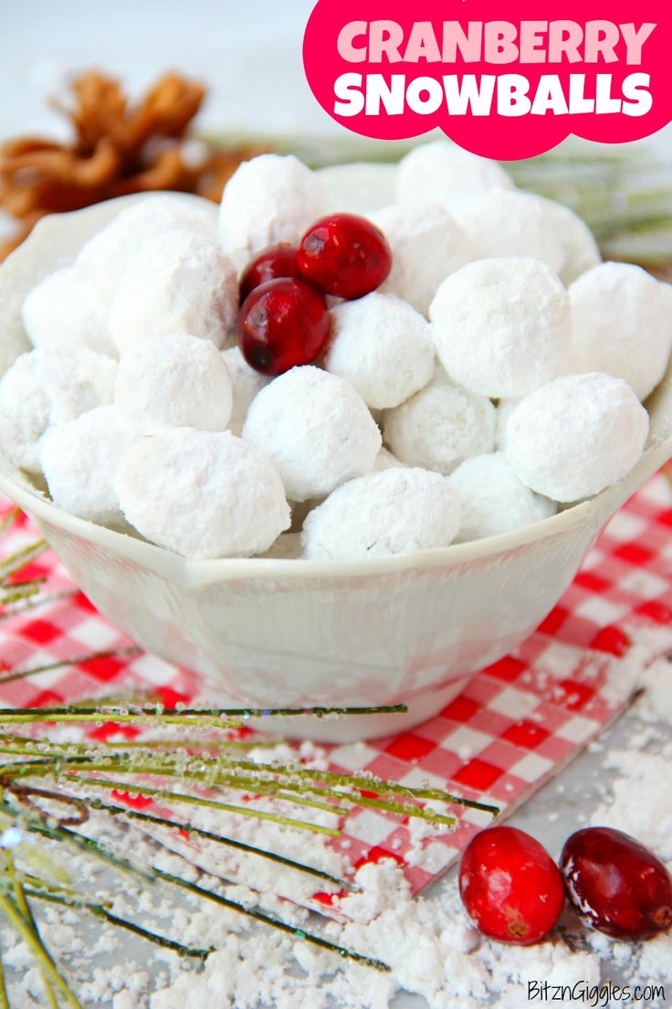 cranberry snowballs in a white bowl on a red and white checkered tablecloth