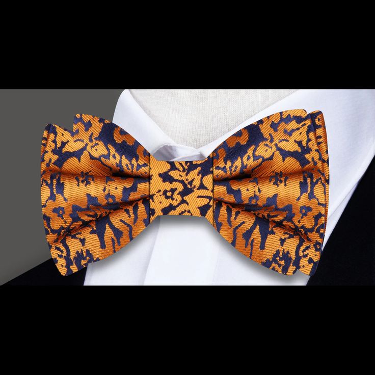 Elevate Your Style with Our Exquisite Floral Silk Bow Tie Are you ready to add a touch of elegance and sophistication to your wardrobe? Look no further than our Exquisite Floral Silk Bow Tie. Crafted from luxurious silk and featuring a detailed floral pattern in shades of orange and dark blue, this bow tie is the perfect accessory to elevate your look for any occasion. Whether you're attending a wedding, a business meeting, or a formal event, our versatile bow tie is sure to make a statement and Elegant Multicolor Ties For Wedding, Elegant Multicolor Wedding Ties, Yellow Fitted Bow Tie For Formal Occasions, Formal Yellow Bow Tie, Formal Fitted Yellow Bow Tie, Formal Yellow Fitted Bow Tie, Silk Bow Tie For Formal Occasions, Silk Party Ties, Elegant Yellow Bow Tie For Black Tie Events